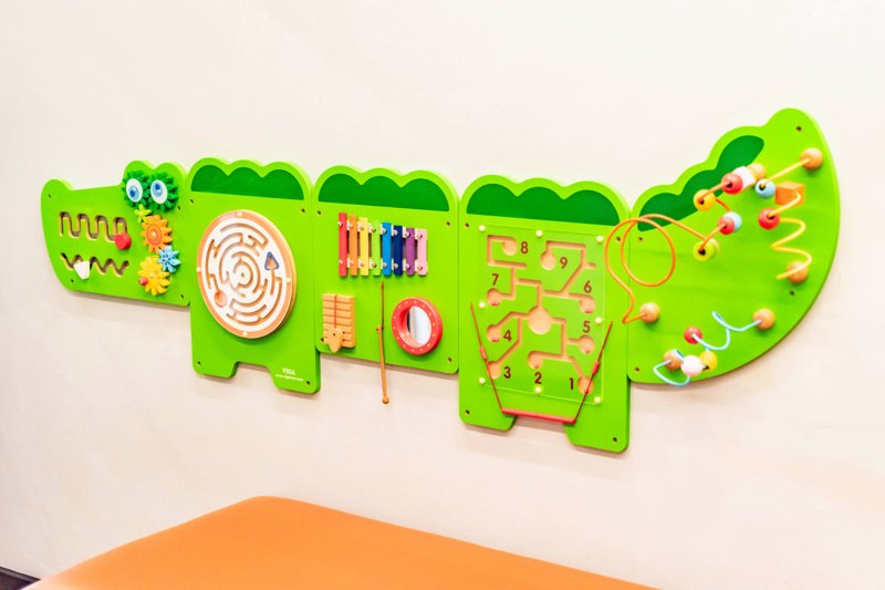Colourful crocodile activity board in the children’s play area