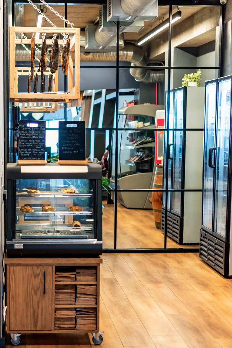 The deli displays and wine shelves inside Prime Wagyu